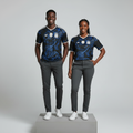 Nigerian male and female models wearing the Unisex Black Blue Baroque Swirl Football Jersey side by side