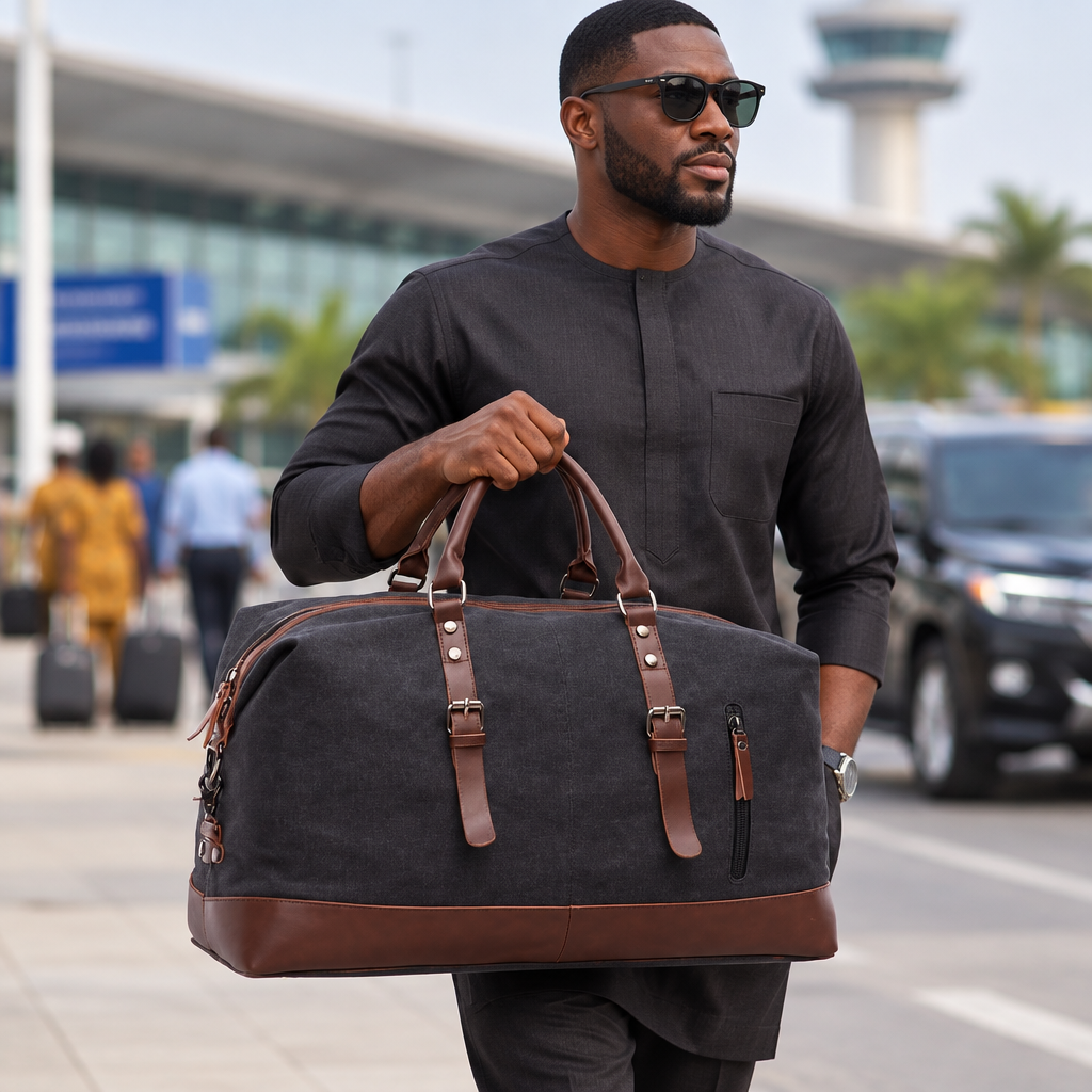 Nigerian man carrying charcoal travel bag with brown trim