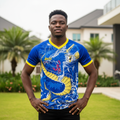 Nigerian male model wearing royal blue yellow dragon football jersey front view
