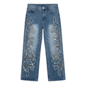 Blue wide-leg jeans with grey abstract appliqués and frayed outlines