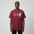 Black male model wearing a burgundy Talk Normal fingerprint graphic T-shirt