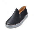 Black textured slip-on shoe with elastic side panel and grey sole