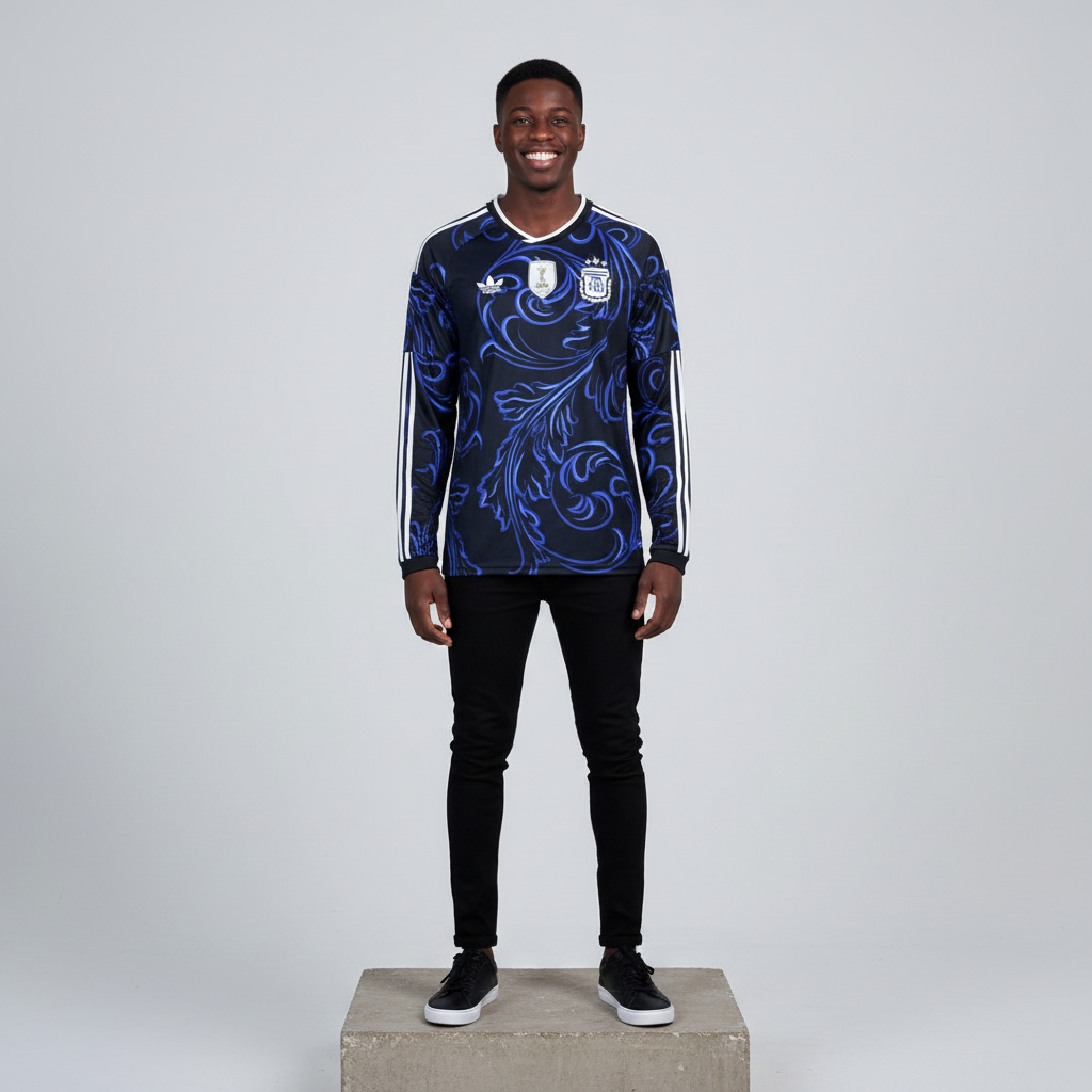 Nigerian male model wearing black blue baroque long sleeve football jersey on concrete plinth