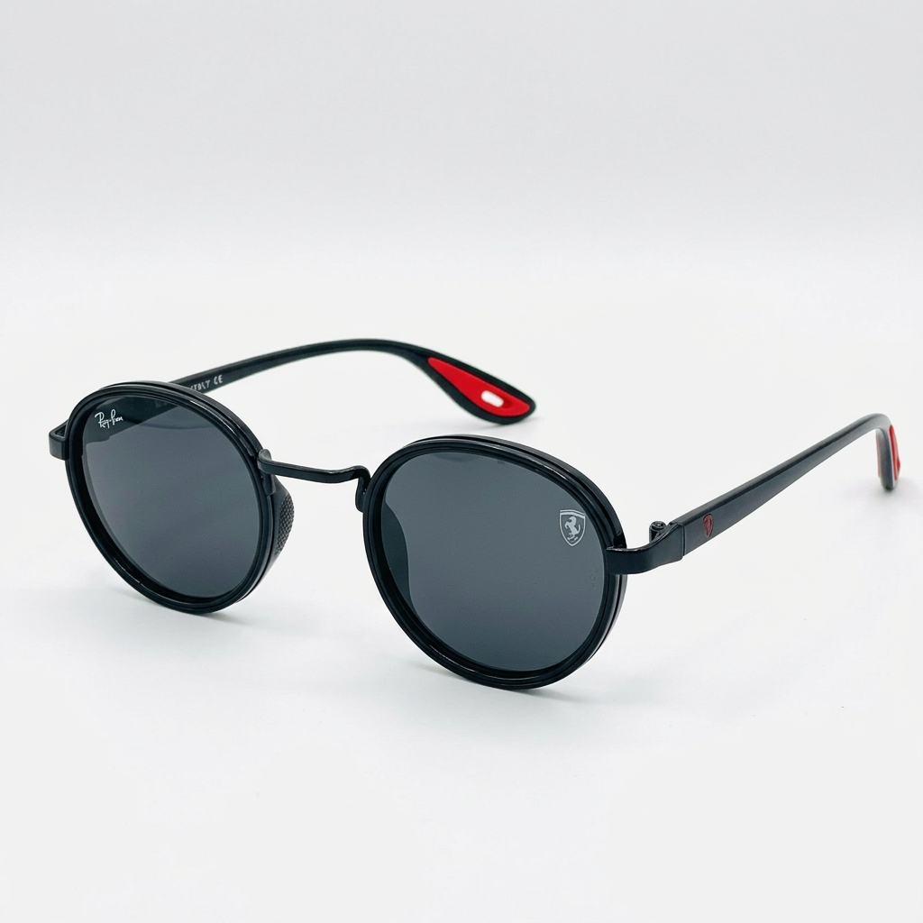 Glossy black rounded sunglasses with dark lenses and red temple-tip accents
