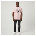 Black Nigerian male model wearing a pink skate graphic T-shirt