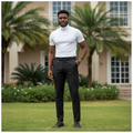 Nigerian male model wearing black pinstripe slim fit dress trousers in upscale outdoor setting