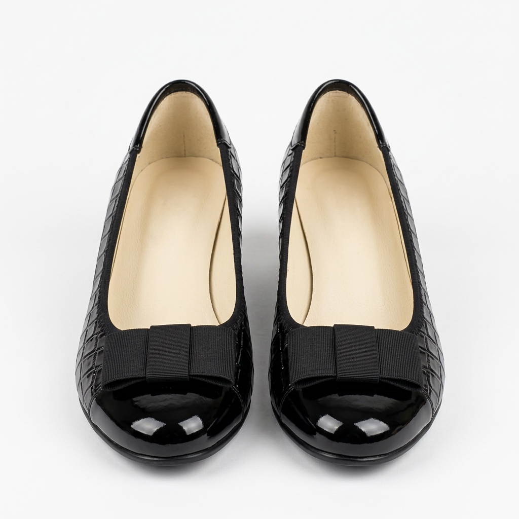 Matching black croc-embossed bow wedge shoes