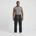 Adult Black model wearing dark charcoal straight-leg joggers with white rope drawstrings