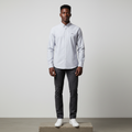 Nigerian male model wearing silver grey plain long-sleeved shirt, front view