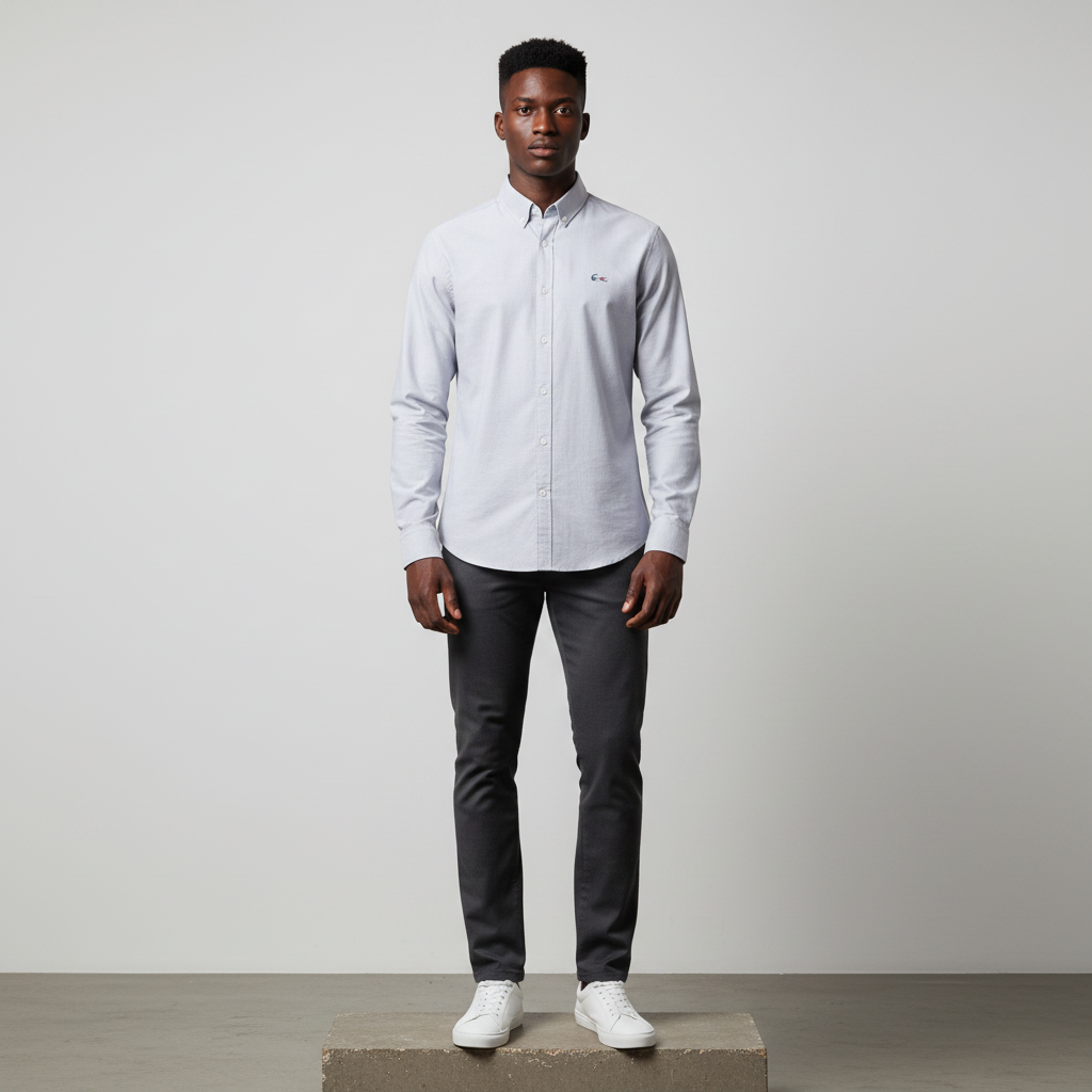 Nigerian male model wearing silver grey plain long-sleeved shirt, front view
