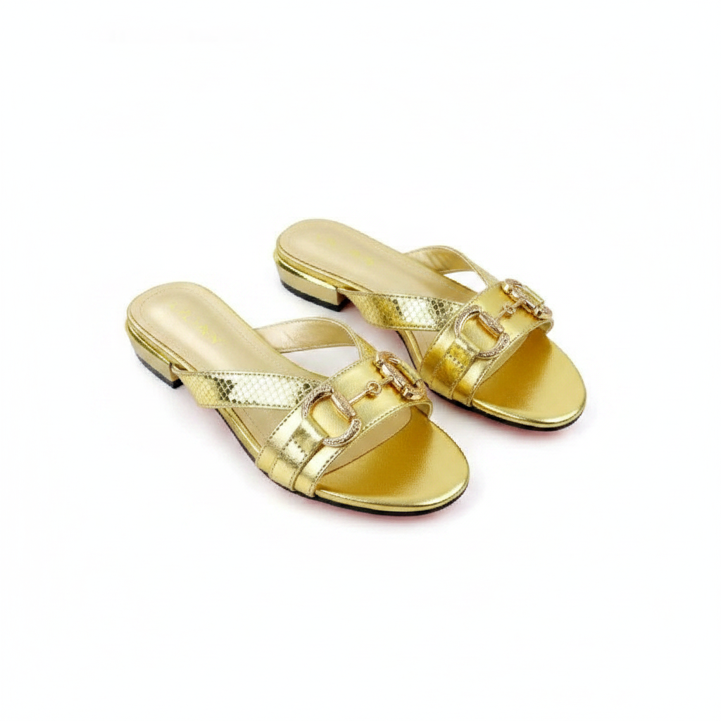 Ghost mannequin pair view of gold metallic horsebit flat slide sandals, left and right shoe