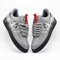 Pair of grey graphic rope-lace low-top sneakers on a white background