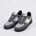Ghost mannequin pair of grey black-sole sneakers matching the model shot design