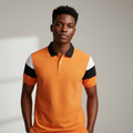 Nigerian model wearing orange colourblock polo shirt