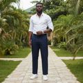 Nigerian male model wearing navy blue wide-leg trousers in outdoor setting