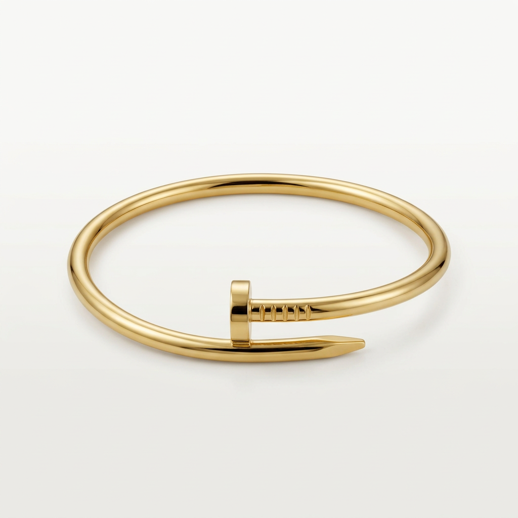 Gold-tone nail-shaped bracelet isolated on white