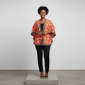 Orange Leaf Print Adire Batwing Shirt – Model Front View