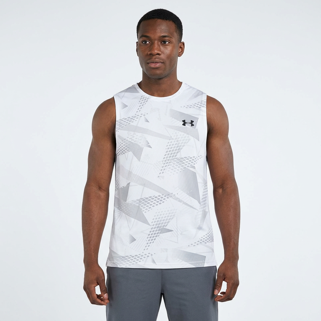 Man wearing white geometric sleeveless top on plain studio background