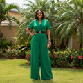 Women's short-sleeve V-neck belted wide-leg jumpsuit in green – Nigerian female model front view