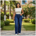 Nigerian female model wearing navy blue rhinestone sparkle wide-leg jeans - front view
