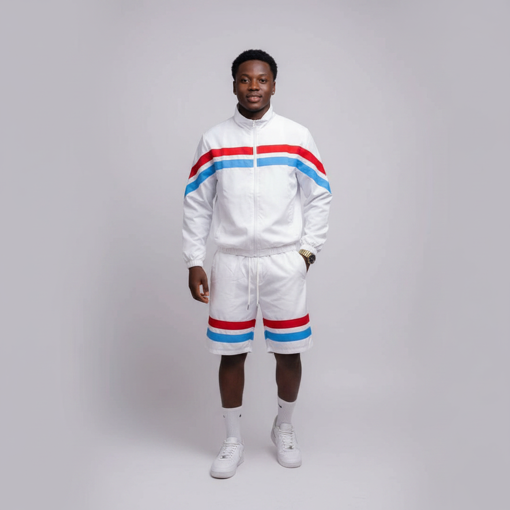 Model wearing the white jacket and shorts set with red and blue stripes