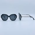 Unisex oversized round black sunglasses with silver hinge detail – front and side view on white background