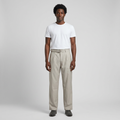 Full-body male model wearing light beige belted trousers