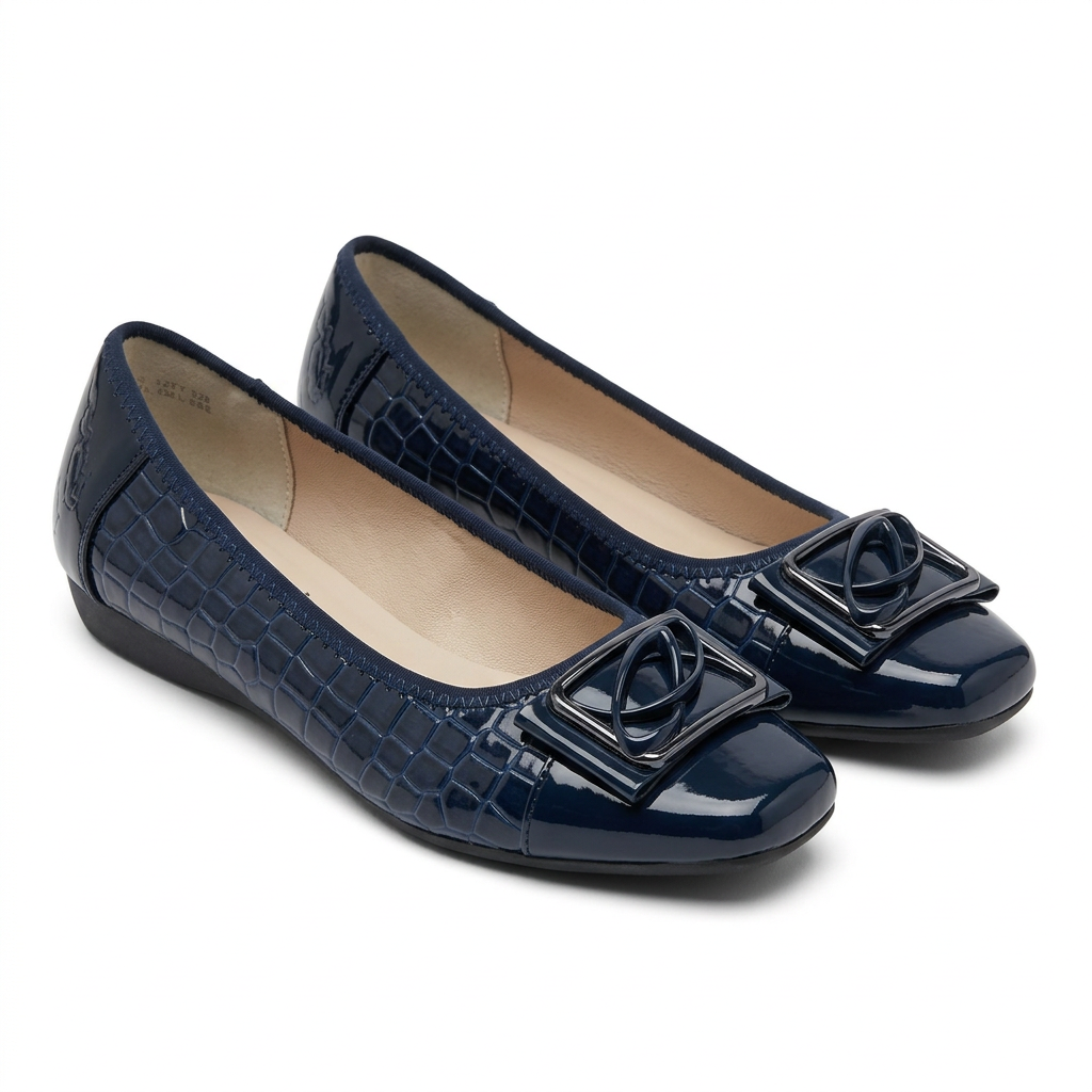 Pair of glossy navy croc-effect bow flats on white background