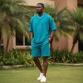 Nigerian male model wearing plain teal matching co-ord set outdoors