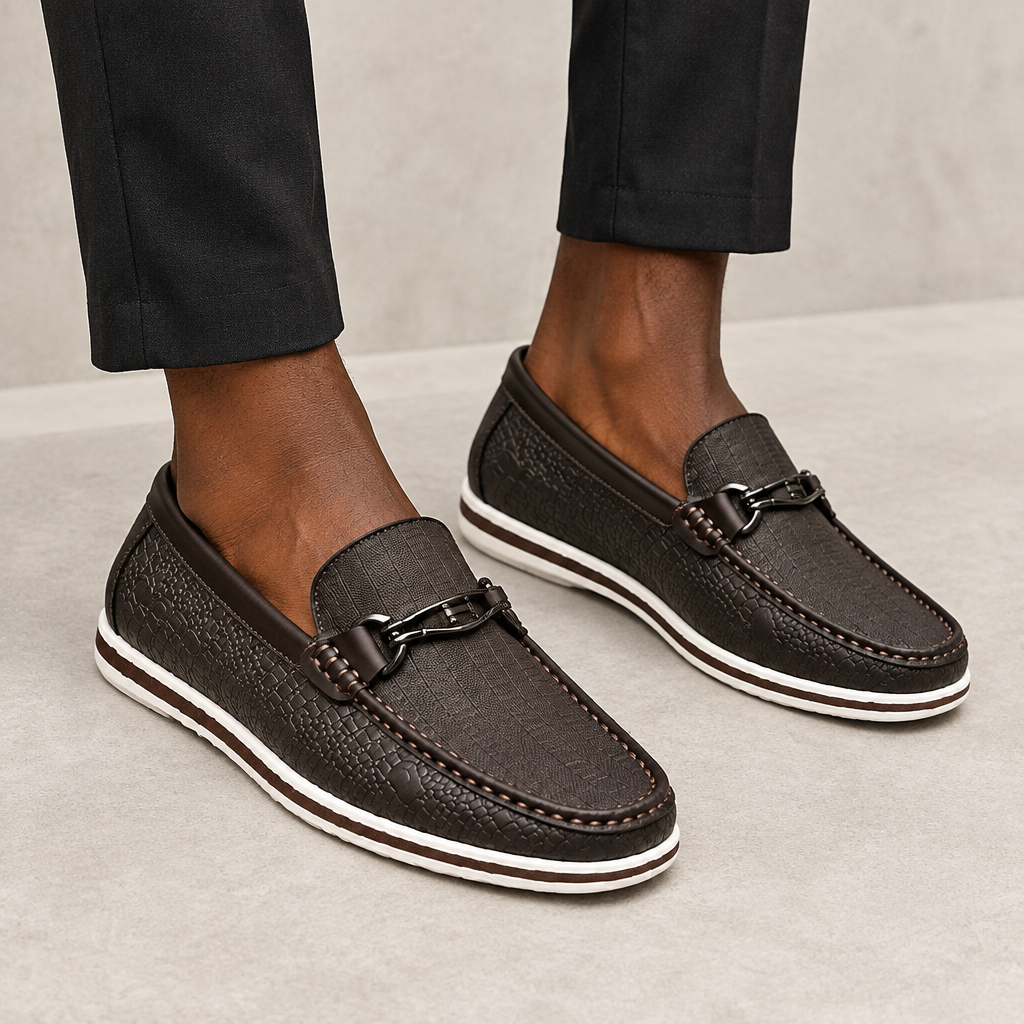 Black textured bit loafers worn on both feet