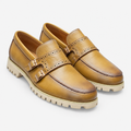Tan men's double-buckle brogue loafers shown as a complete pair