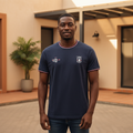 Nigerian male model wearing navy badge tee, front view
