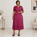 Adult Black woman wearing a berry V-neck pleated dress