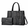 Black structured handbag and matching separate purse on white background