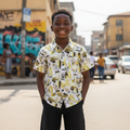 Young Nigerian boy wearing white abstract brushstroke print shirt