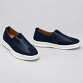 Men's navy blue slip-on sneakers with suede panels, front and side view