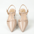Nude glossy pointed-toe T-strap low-heel shoe pair