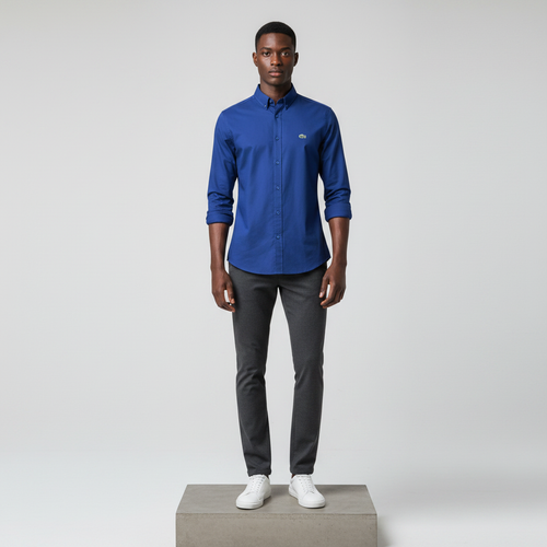 Nigerian male model wearing cobalt blue plain long-sleeved shirt, front view