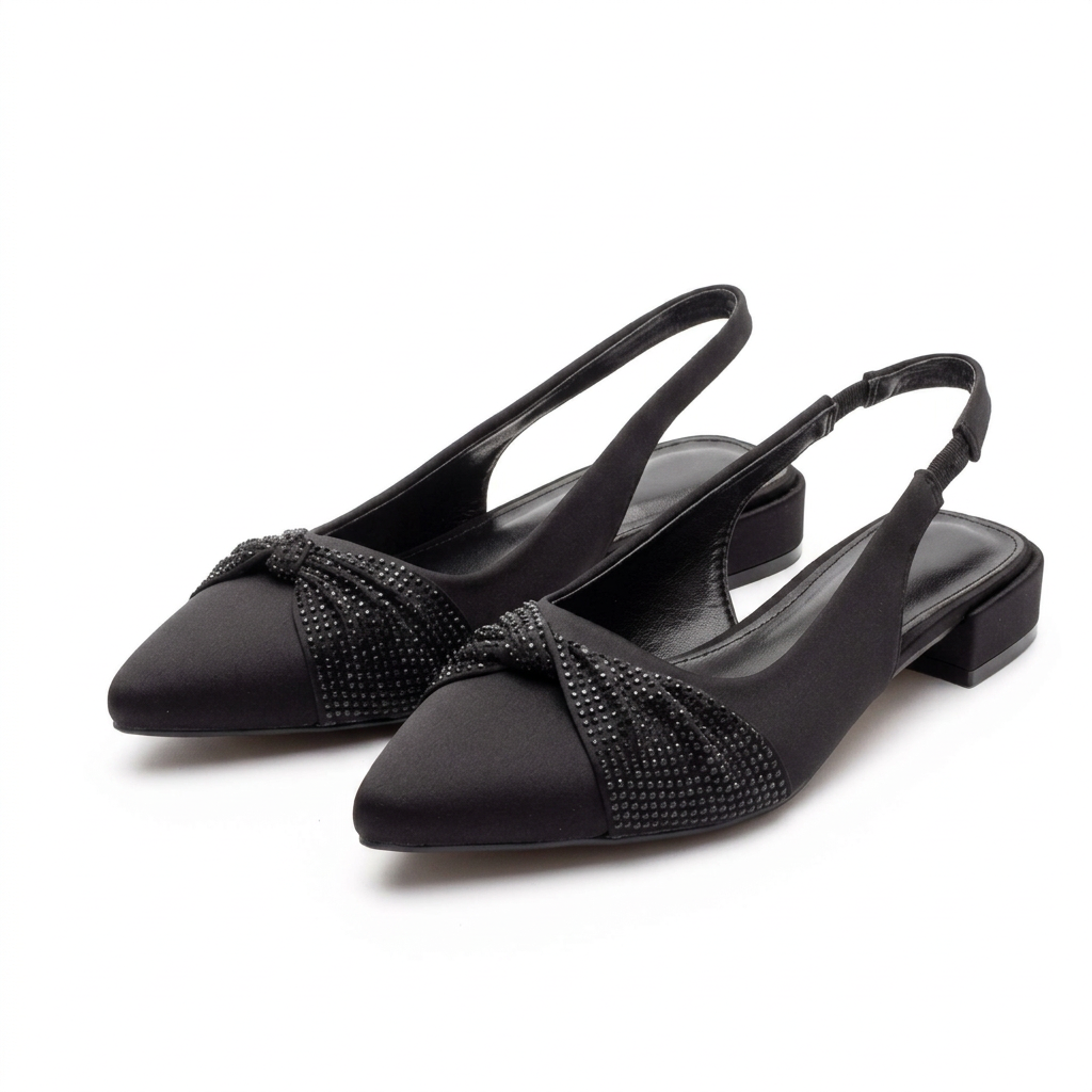 Pair of black embellished-knot pointed slingbacks on white