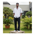 Nigerian male model full body wearing men's white black trim boxy short-sleeve shirt