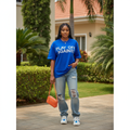 Nigerian female model wearing royal blue play off against statement oversized tee – front view
