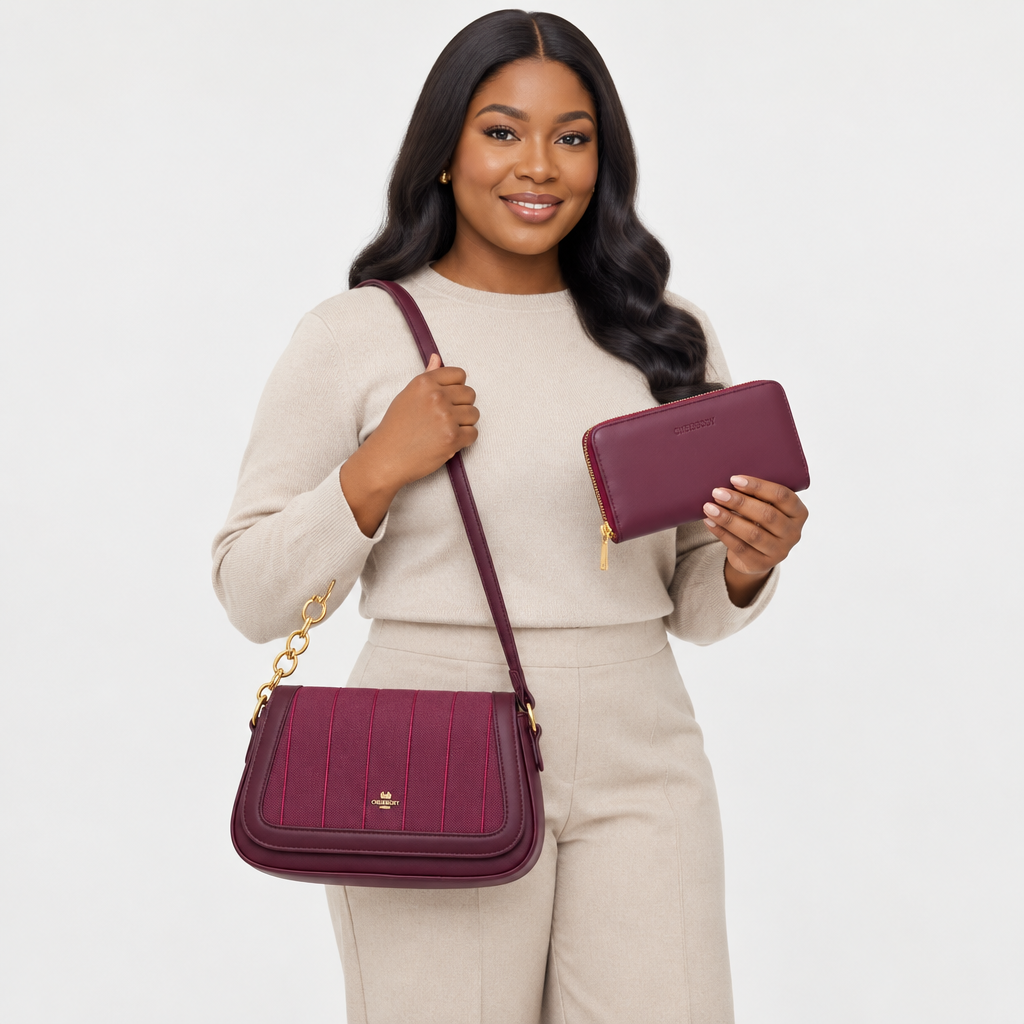 Adult woman carrying a burgundy shoulder bag and matching wallet