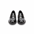 Women's black patent leather penny loafer with gold hardware and lug sole – pair shot