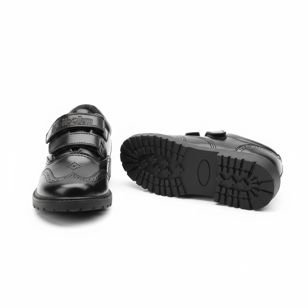 Kids' black velcro brogue school shoes ghost mannequin pair front and sole view