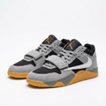 Pair of grey and black strap sneakers with gum-coloured soles on a white background