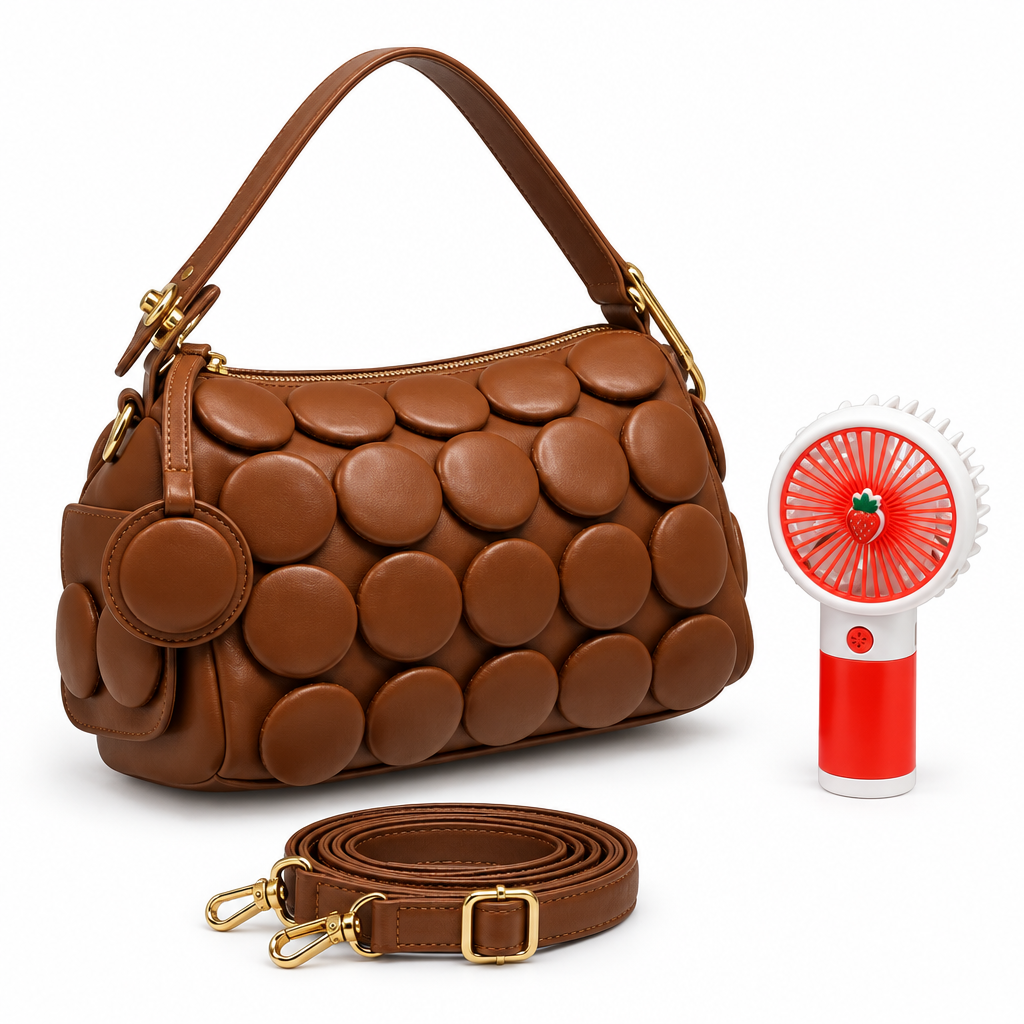 Brown circle-appliqué shoulder bag with matching strap and red handheld fan on white background