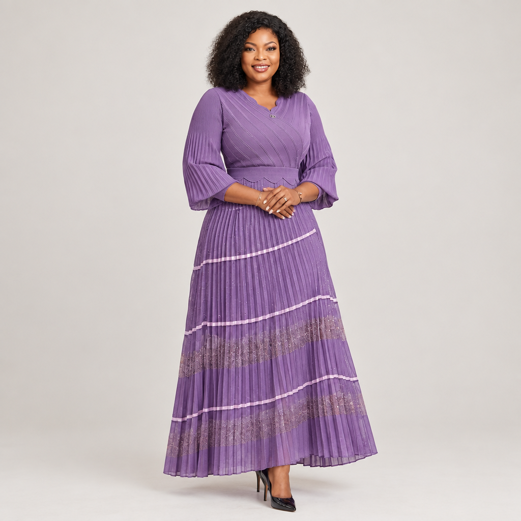 Black Nigerian model wearing a lavender tiered pleated gown with bell sleeves and metallic floral-pattern panels