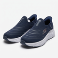Pair of navy wave-detail mesh slip-ons with white sculpted soles on white