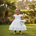 Young Nigerian toddler girl wearing white rosette lace puff sleeve tulle party dress