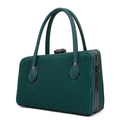 Deep teal ribbed twin-handle handbag with dark metallic frame on white